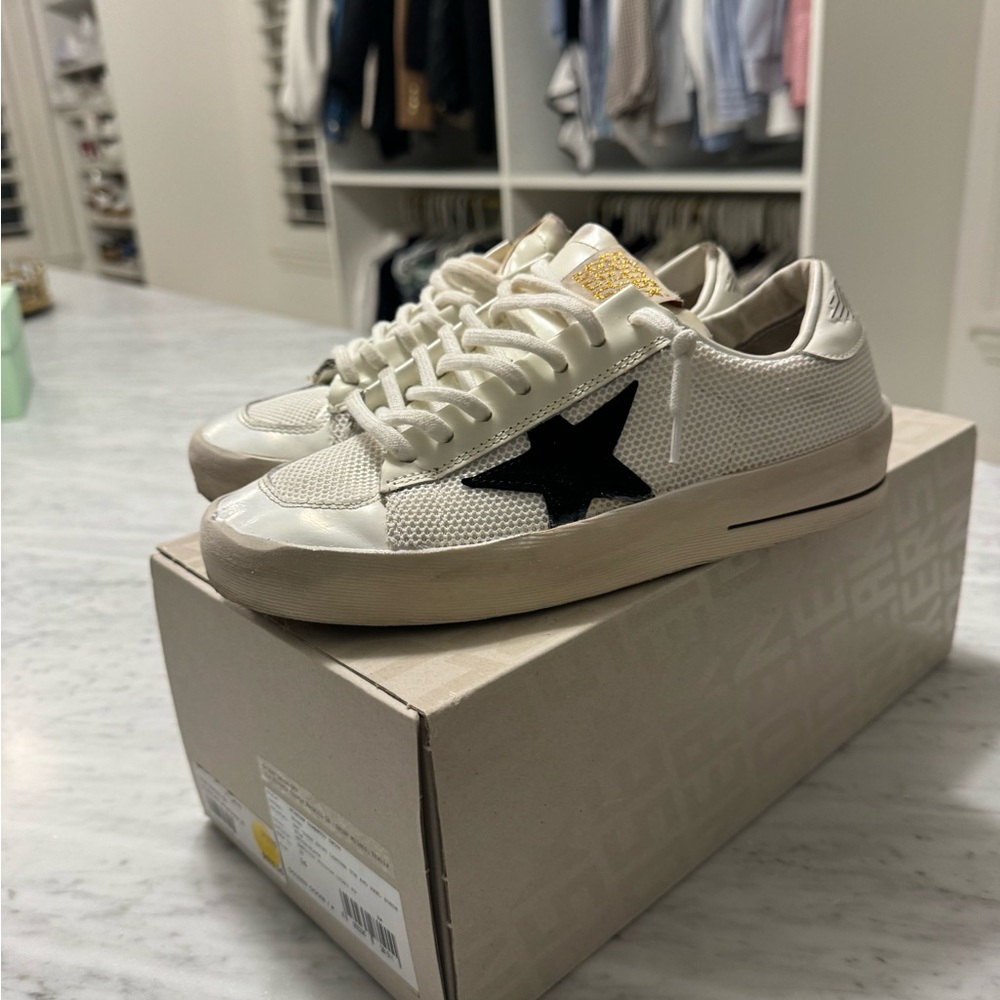 Authentic with the box gently used StarDan white with black star size 36